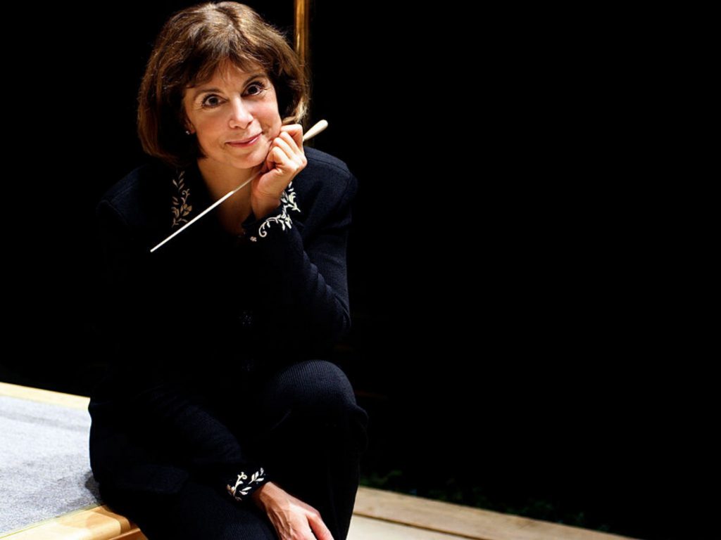 photo og joann falletta on dark stage