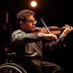 photo of man playing violin