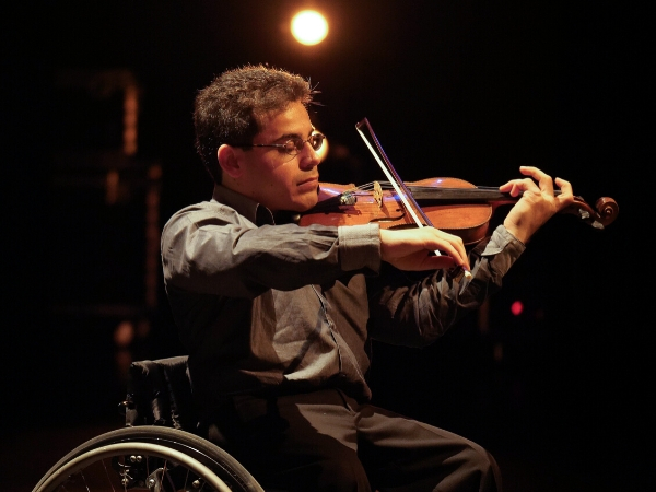 photo of man playing violin