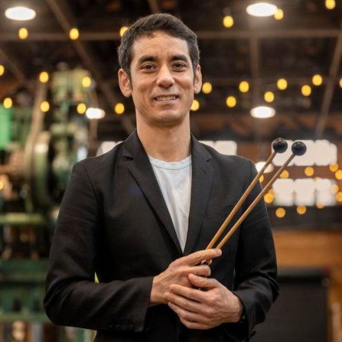 Photo of Andy Akiho holding drum mallets