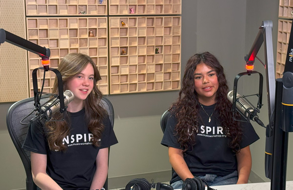 Two teens in a recording studio
